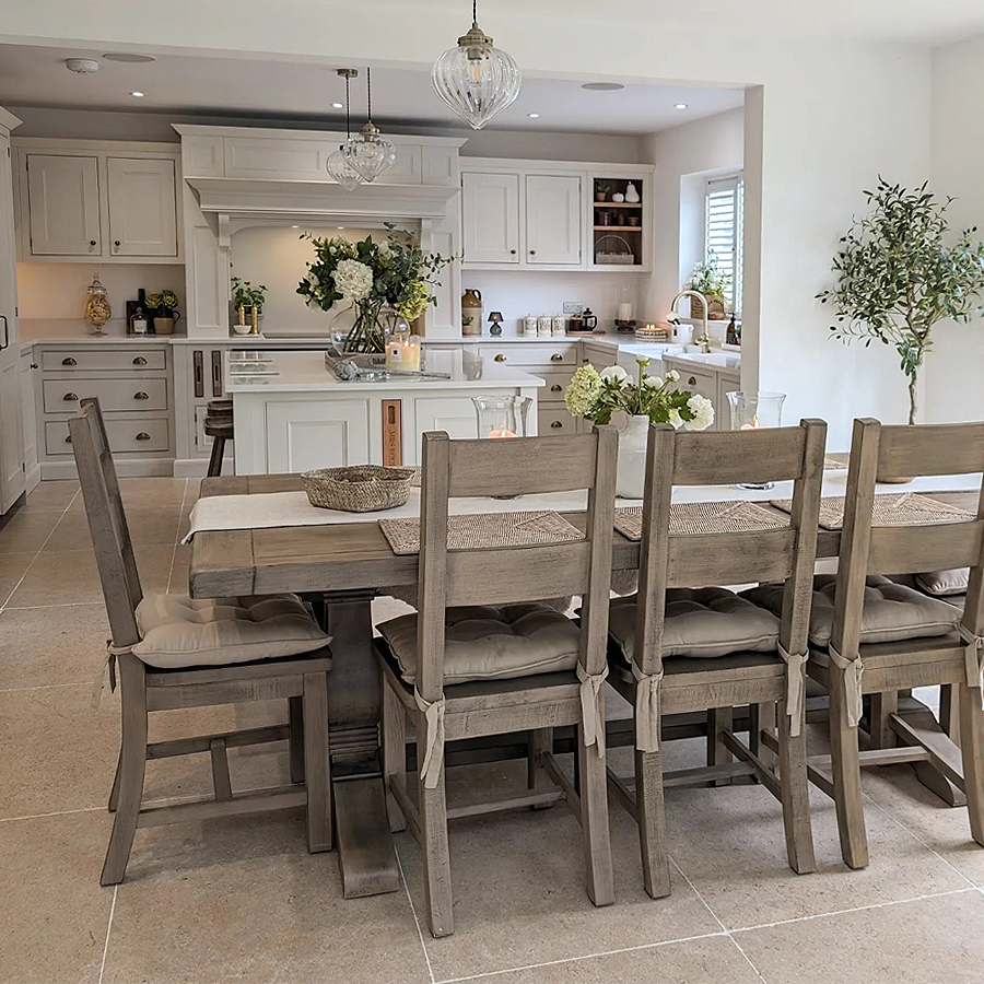 Polished beige limestone-effect kitchen floor tiles